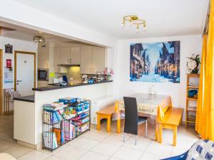 a kitchen and dining room with a table and chairs at Villa Nova - 0402 + box 24 in Middelkerke