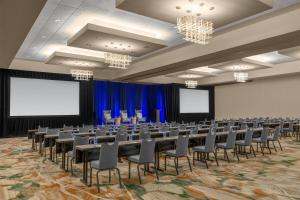 a conference room with tables and chairs and a screen at Embassy Suites San Antonio Riverwalk-Downtown in San Antonio +129 photos