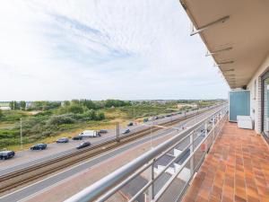 a balcony with a view of a highway at Rubens - 0505 in Middelkerke +4 photos