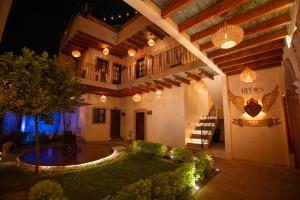 a building with a staircase and lights on it at night at Hotel Bitos Boutique in San Miguel de Allende