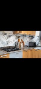 a kitchen with a stove and a counter top at Le mirage in Tozeur