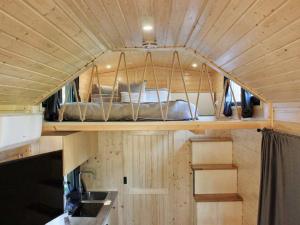 an inside view of a tiny house with a bed at Sugar Hut by Tiny Away in Great Horkesley