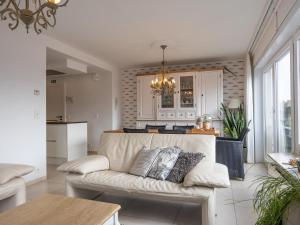 a living room with a couch and a kitchen at Rising Sun - 0101 in Westende-Bad