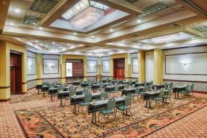 a room with rows of tables and chairs in it at DoubleTree by Hilton Spokane City Center in Spokane +74 photos