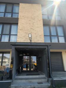 a building with a hallway leading into a building at Sunny Apartment in Oradea