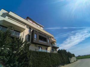 a building on the side of a road at Sunny Apartment in Oradea