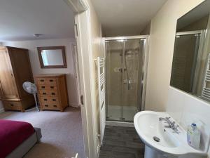 a bathroom with a sink and a shower at The Joiners Shop in Derby +24 photos