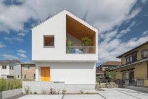 a white house with a large window at NAGASHIMA clas in Kuwana