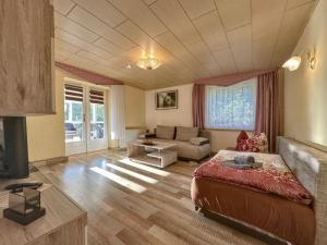 a living room with a bed and a couch at Vogel in Pirna