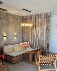 a living room with a couch and a table at למרגלות הגלבוע in Gid‘ona +18 photos