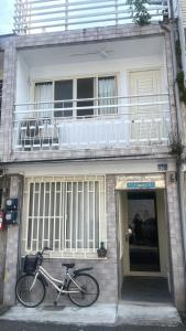 a bike parked in front of a building at 私美宅居 in Zhushan