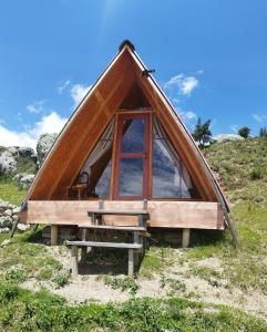 a small tent with a bench in front of it at Casa rural mirador wilcacocha in Huaraz