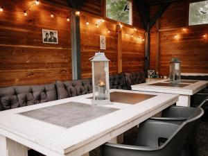 a conference room with tables and chairs and lights at Friedensthal in Bad Pyrmont