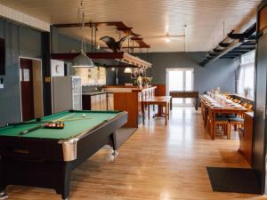a billiard room with a pool table and some tables at Friedensthal in Bad Pyrmont