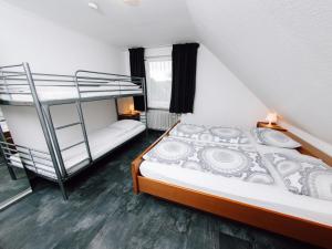 a bedroom with two bunk beds and a ladder at Friedensthal in Bad Pyrmont +45 photos