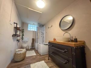a bathroom with a sink and a toilet and a mirror at Münstermaifeld in Münstermaifeld +40 photos