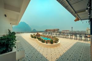 a pool on the roof of a building at Dream Future VangVieng Hotel in Vang Vieng