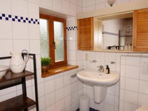 a bathroom with a sink and a mirror at Weitblick in Zenting +20 photos