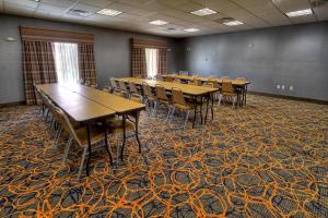 a conference room with tables and chairs in it at Hampton Inn and Suites Ada in Ada