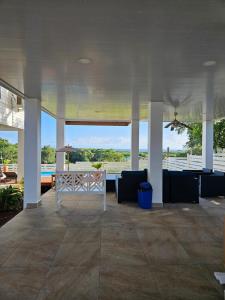 a pavilion with a view of the ocean from a house at Sea view house in Utila