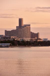 a large building next to a large body of water at Hilton Tokyo Odaiba in Tokyo