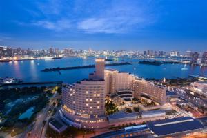 a view of a city skyline at night at Hilton Tokyo Odaiba in Tokyo