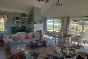 a living room with a couch and a table at Agritourism, family studio in Ładzin