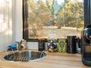 a kitchen counter with a sink and a window at Blue Gum at Langdale 1 by Tiny Away in Bungendore +23 photos