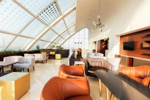 a living room with a large glass ceiling at Doubletree By Hilton Mexico City Santa Fe in Mexico City