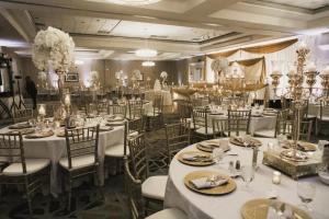 a banquet hall with white tables and chairs at Doubletree by Hilton Pleasant Prairie Kenosha, WI in Pleasant Prairie +26 photos