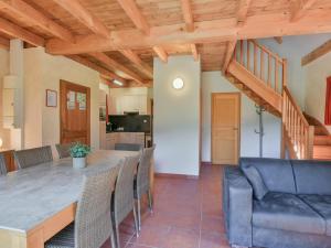 a kitchen and dining room with a table and chairs at Lac Bleu Nr 38 in Lacapelle-Marival