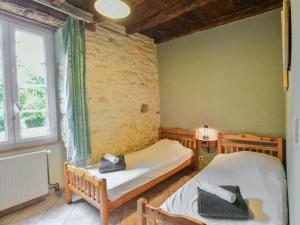 a bedroom with two beds and a window at Tournesol in Dégagnac +34 photos