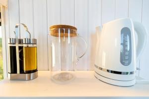 a blender sitting on a counter next to a blender at The High Country Views Escape by Tiny Away in Table Top +21 photos