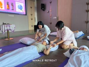 a group of three women in a yoga class at Whale Retreat Destination in Hat Yai +26 photos