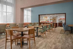 a waiting room with tables and chairs in a store at Hampton Inn Yemassee/Point South, Sc in Yemassee