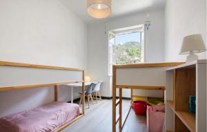 a bedroom with a bunk bed and a table at Casa Garibotti in Recco
