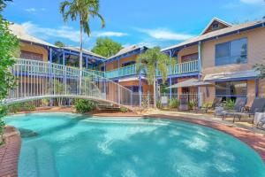 a large swimming pool in front of a building at The Zoo House in Broome