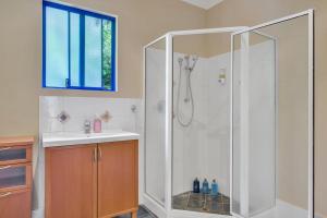 a bathroom with a shower and a sink at The Zoo House in Broome +31 photos