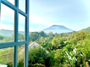 a view of a mountain from a window at Amrita Villa Sidemen in Sidemen