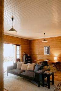 a living room with a couch and a table at Norfolk House in Dunsborough