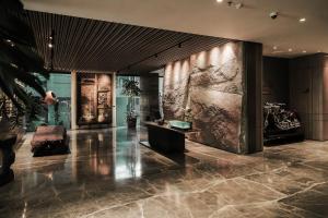 a lobby with a motorcycle on the wall at PULANG ke UTTARA in Yogyakarta +59 photos