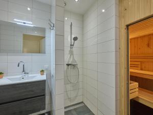a bathroom with a shower and a sink at Sauna Zee 27A in Colijnsplaat +28 photos