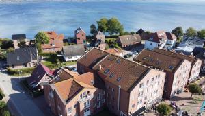 an aerial view of a town by the water at Panoramablick-Orther-Hafen-Fehmarn in Orth