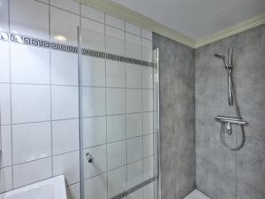 a bathroom with a shower and a sink at t Kaatsheuveltje 2 in Kaatsheuvel +26 photos