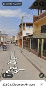 a street with signs on the side of the road at Departamento Moderno y Acogedor con aire acondicionado in Tumbes