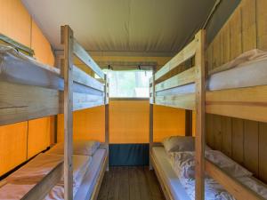 a bunk bed room with two bunk beds in it at Safaritent 6 in Vessem +19 photos