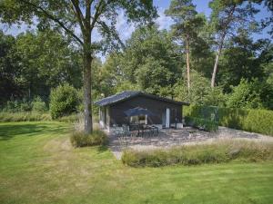 a small cabin in the middle of a field at Quercus in Valkenswaard