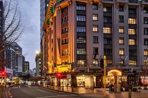 a tall building on a city street at night at Doubletree By Hilton Wellington in Wellington
