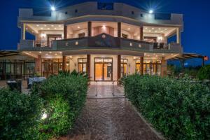 a large building with a lot of windows at Athena's Holiday Home - Ideal for large groups, by ZanteWize in Tsilivi