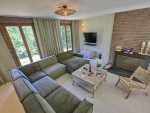 a living room with a couch and a table at Silt in Schinnen